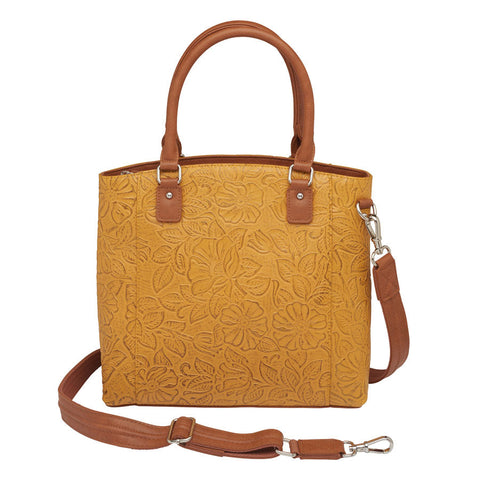 Mustard yellow concealed carry town tote in hand-tooled American cowhide, featuring dual zip-access gun compartment, slash-resistant shoulder straps, and spacious main section with RFID protection