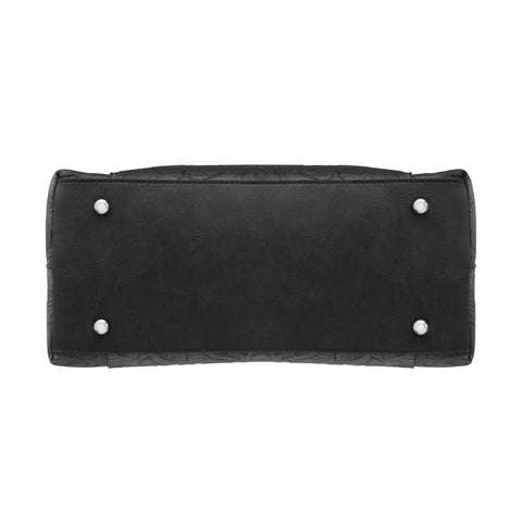 Black tooled leather concealed carry town tote crafted from USA cowhide, with discreet dual-zip gun access, reinforced slash-resistant straps, and RFID-lined interior for secure everyday carry.