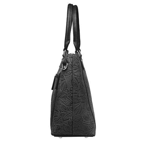 Black tooled leather concealed carry town tote crafted from USA cowhide, with discreet dual-zip gun access, reinforced slash-resistant straps, and RFID-lined interior for secure everyday carry.