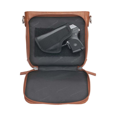 Tan concealed carry crossbody purse in washable American cowhide leather with RFID wallet organizer, slash-resistant steel cable strap, secure magnetic flap, triple-zippered gun access for compact firearms like Ruger LCP and Kahr 9, perfect for women seeking discreet protection and clean styling.