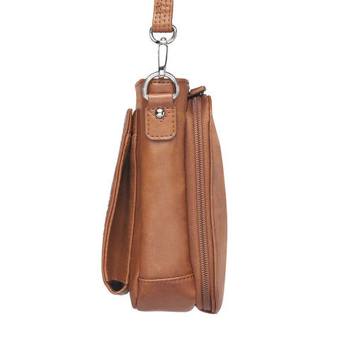 Tan concealed carry crossbody purse in washable American cowhide leather with RFID wallet organizer, slash-resistant steel cable strap, secure magnetic flap, triple-zippered gun access for compact firearms like Ruger LCP and Kahr 9, perfect for women seeking discreet protection and clean styling.