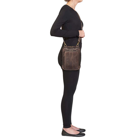 Brown Distressed full grain buffalo leather concealed carry shoulder pouch with slash-resistant crossbody strap, multi-directional draw options, and secure back zipper compartment — fits revolvers up to 1911 Commander.