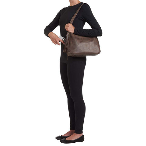 Distressed brown leather HOBO concealed carry purse with tassel draw marker, full-grain buffalo leather, dual main compartments, RFID zip pocket, padded CCW pocket fits Glock 19 or S&W Shield, slash-resistant strap, and antique brass hardware.