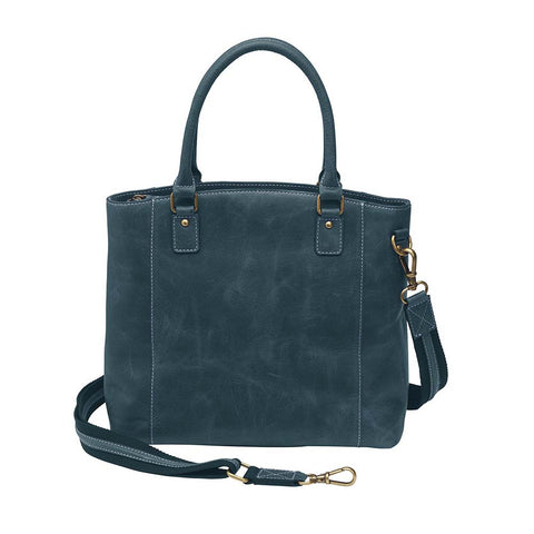 Rich distressed blue leather town tote purse with concealed carry pocket. Made from vintage full grain buffalo leather with soft, worn-in feel that deepens over time. Slash-resistant adjustable crossbody strap with padded gun compartment to prevent imprinting. Includes front and rear zippered pockets, designed for left or right hand draw. Comes with trusted Mernickle holster, perfect for discreet everyday carry with style and durability.