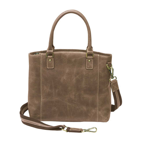 Distressed brown full grain buffalo leather town tote with concealed carry compartment. Vintage-inspired patina develops with use. Features reinforced slash-resistant shoulder strap, padded interior for gun protection, and dual top handles for versatile carry. Designed for ambidextrous draw, includes multiple pockets for phone, pepper spray, and essentials. Tested with popular pistols, equipped with Mernickle holster. Durable and stylish everyday concealed carry purse.