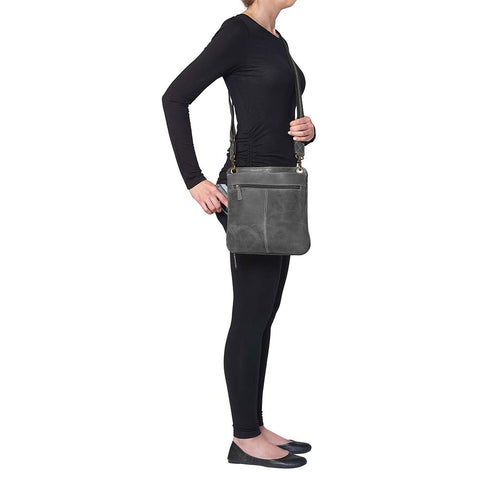 Step up your carry game with this understated, stylish gray distressed buffalo leather purse. Soft to the touch but tough in design, it molds to your lifestyle and grows more distinctive with every use. Designed for quick-draw pros who want a clean look without sacrificing function.