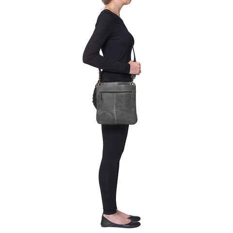 Step up your carry game with this understated, stylish gray distressed buffalo leather purse. Soft to the touch but tough in design, it molds to your lifestyle and grows more distinctive with every use. Designed for quick-draw pros who want a clean look without sacrificing function.
