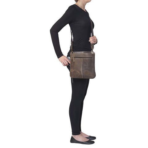 Crossbody Flat Sac Concealed Carry Purse — Rugged Brown Vintage Leather

Rock that classic vintage vibe with this distressed full grain buffalo leather crossbody purse. The rich brown leather ages like fine wine — softening and gaining character with every wear and tear. Built tough and lightweight, it’s made for both left and right-handed carriers who need stealth and speed.