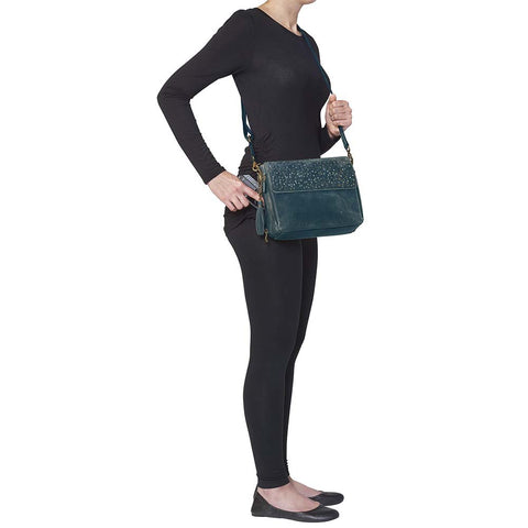 Step up your carry game with this vintage-inspired clutch in rich distressed blue full-grain buffalo leather. The more you rock it, the softer and more unique it becomes thanks to the natural aging process and oils infused during tanning. Designed for both left and right-hand carry, it features special padding to prevent imprinting, plus a slash-resistant shoulder strap reinforced with 11-ply steel wire for maximum security.