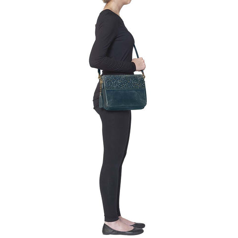 Step up your carry game with this vintage-inspired clutch in rich distressed blue full-grain buffalo leather. The more you rock it, the softer and more unique it becomes thanks to the natural aging process and oils infused during tanning. Designed for both left and right-hand carry, it features special padding to prevent imprinting, plus a slash-resistant shoulder strap reinforced with 11-ply steel wire for maximum security.