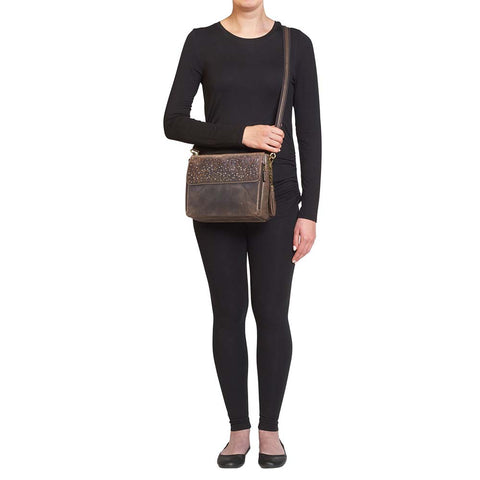 Timeless and tough — this brown distressed full-grain buffalo leather clutch gets better with age and wear. Designed to fit both left and right-handed carriers, it offers special padding to prevent imprinting and a slash-resistant shoulder strap reinforced with 11-ply steel wire for solid security.