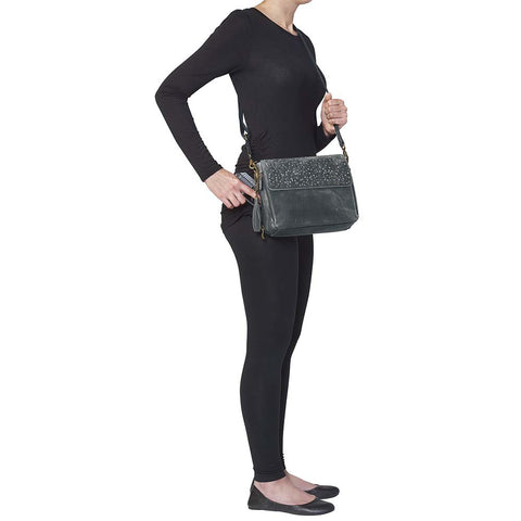 Sleek, stealthy, and practical — this distressed gray leather clutch blends vintage style with tactical function. Made from full-grain buffalo leather, it grows softer and more personal with every use. Equipped for right or left-handed carry, featuring protective padding and a slash-proof shoulder strap reinforced with steel wire.