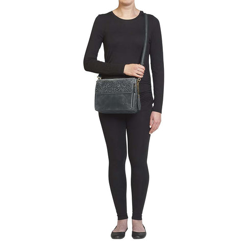 Sleek, stealthy, and practical — this distressed gray leather clutch blends vintage style with tactical function. Made from full-grain buffalo leather, it grows softer and more personal with every use. Equipped for right or left-handed carry, featuring protective padding and a slash-proof shoulder strap reinforced with steel wire.