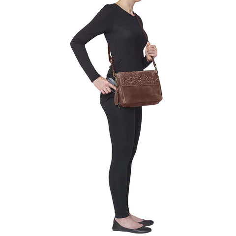 Timeless and tough — this brown distressed full-grain buffalo leather clutch gets better with age and wear. Designed to fit both left and right-handed carriers, it offers special padding to prevent imprinting and a slash-resistant shoulder strap reinforced with 11-ply steel wire for solid security.