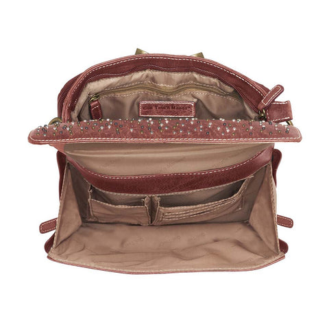 Timeless and tough — this brown distressed full-grain buffalo leather clutch gets better with age and wear. Designed to fit both left and right-handed carriers, it offers special padding to prevent imprinting and a slash-resistant shoulder strap reinforced with 11-ply steel wire for solid security.