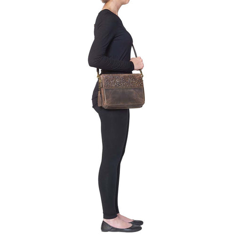 Timeless and tough — this brown distressed full-grain buffalo leather clutch gets better with age and wear. Designed to fit both left and right-handed carriers, it offers special padding to prevent imprinting and a slash-resistant shoulder strap reinforced with 11-ply steel wire for solid security.