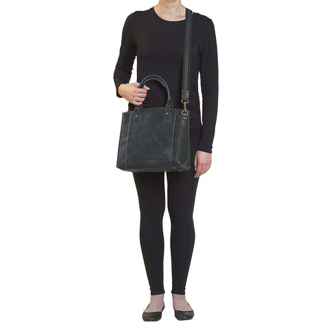 Sophisticated gray distressed full grain buffalo leather concealed carry town tote. Features vintage patina finish that ages gracefully, lightweight yet durable. Equipped with slash-resistant shoulder strap and padded interior for imprint protection. Designed for both left and right handed users, with ample storage including exterior and interior zip pockets. Comes with Mernickle standard holster, tested for reliable concealed carry performance.