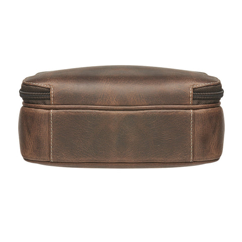 Distressed brown buffalo leather crossbody mail pouch with vintage patina, RFID protection, slash-resistant strap, and concealed carry holster compatible with left or right draw